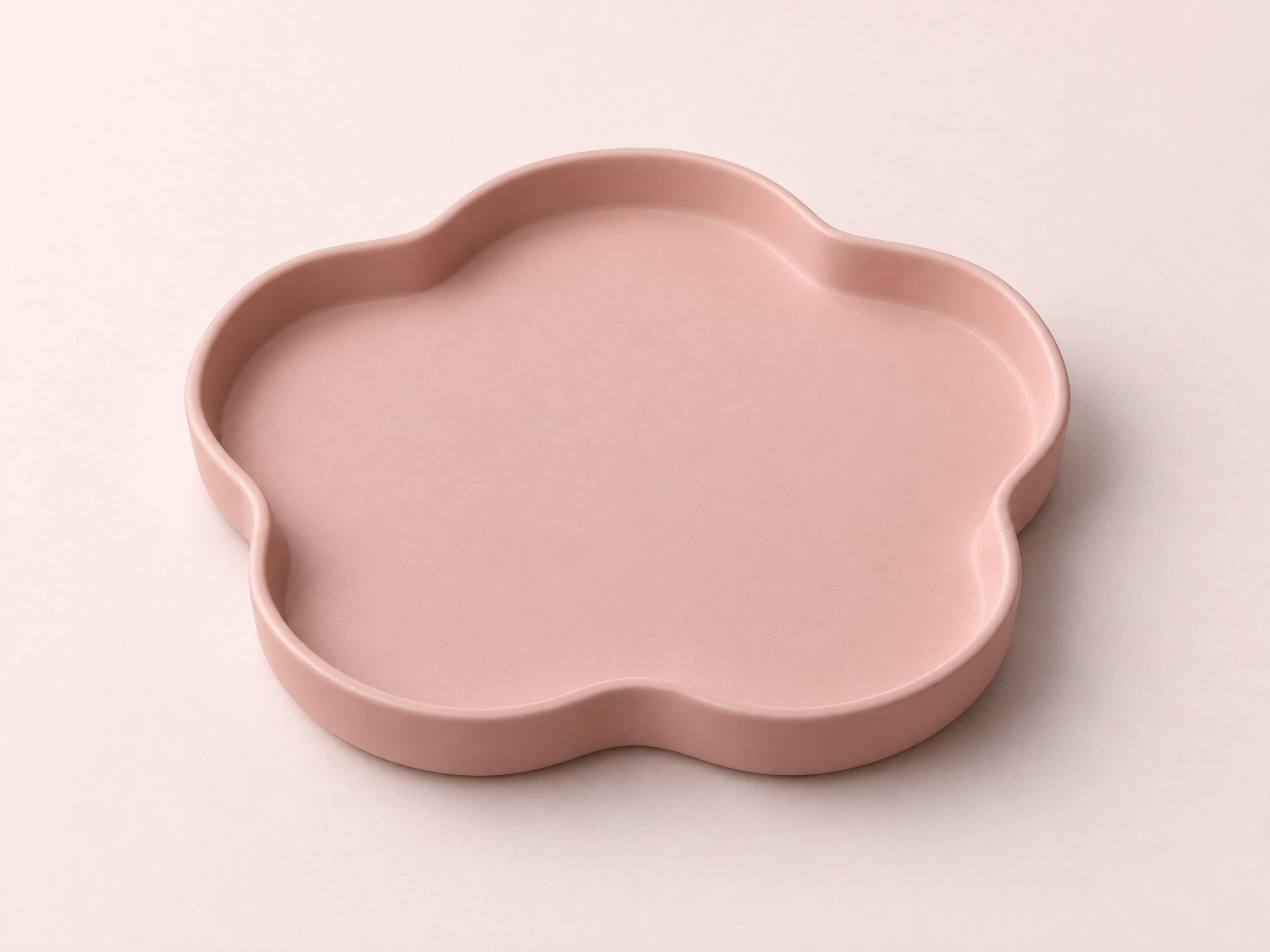 Generated concept image of an empty blush petal-arc tabletop catchall tray