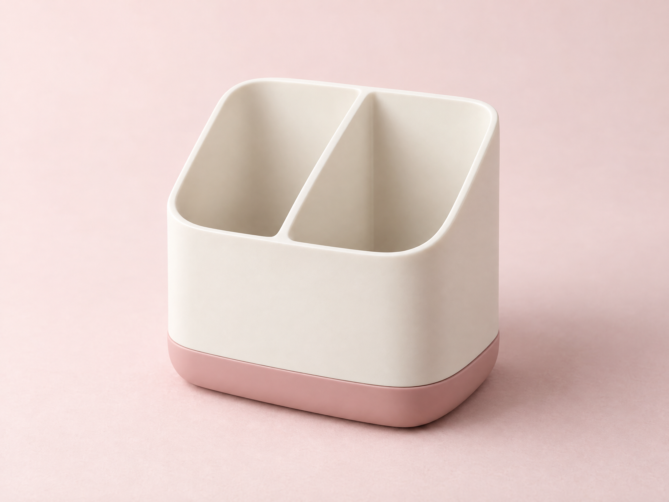 Generated concept image of an empty ivory two-compartment desktop organizer with a blush base
